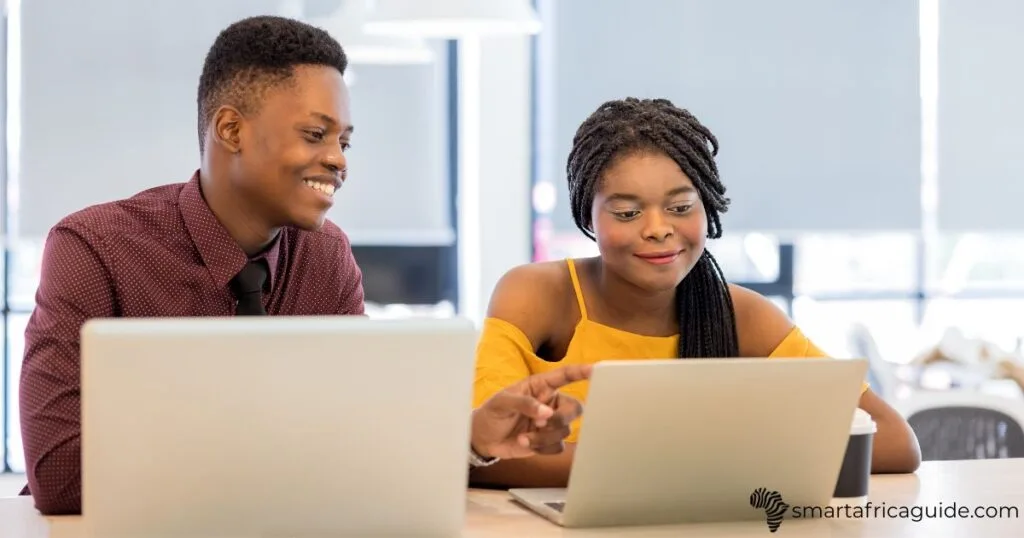 african college students studying on laptop