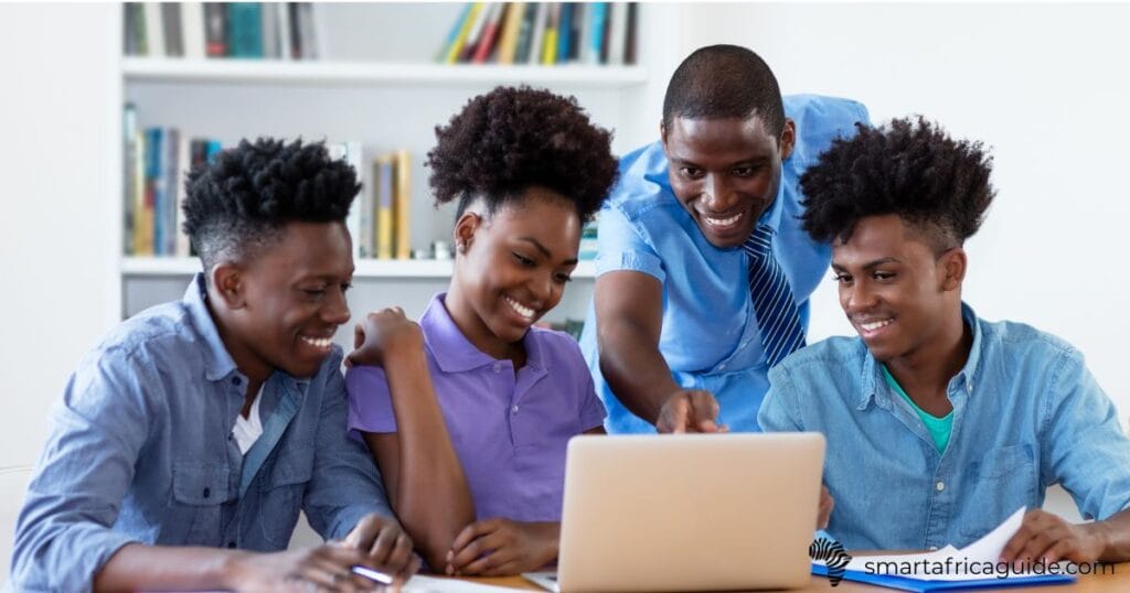 african students doing group project on laptop
