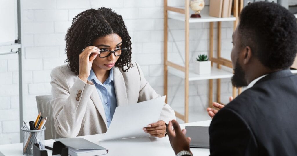 HR in Africa taking interview with CV in Hand