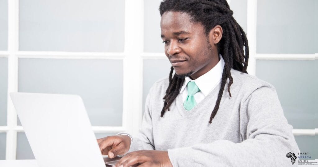 african man writing an email job application