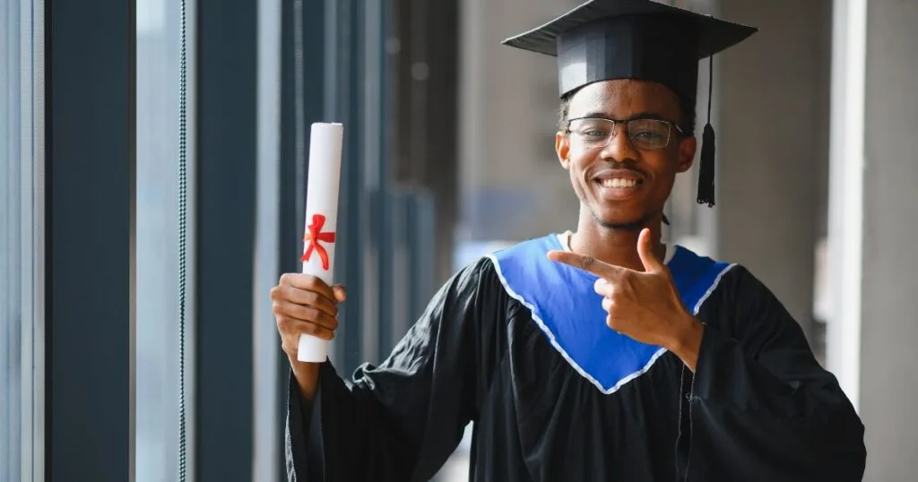 african student holding scholarship certificate