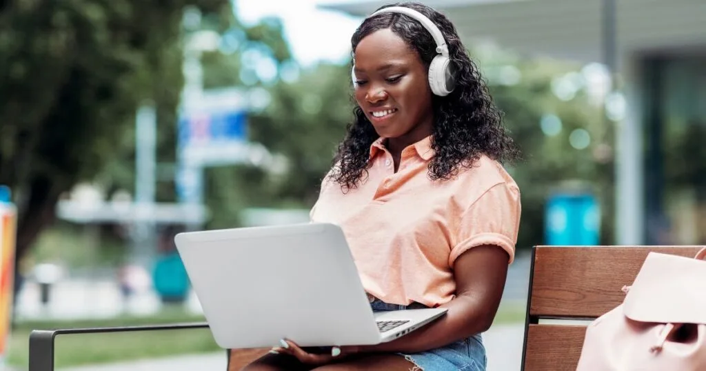 african student working on laptop