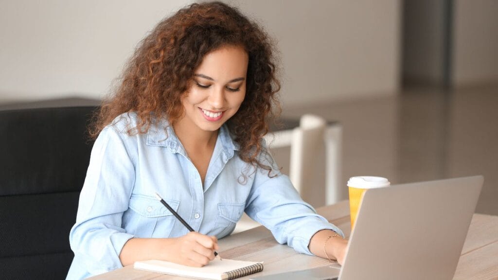 student learning how to upload documents on nsfas using a laptop for the 2025 application