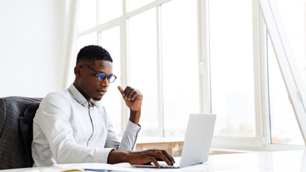 Student in South Africa using a laptop for NSFAS login on the MyNSFAS portal at home