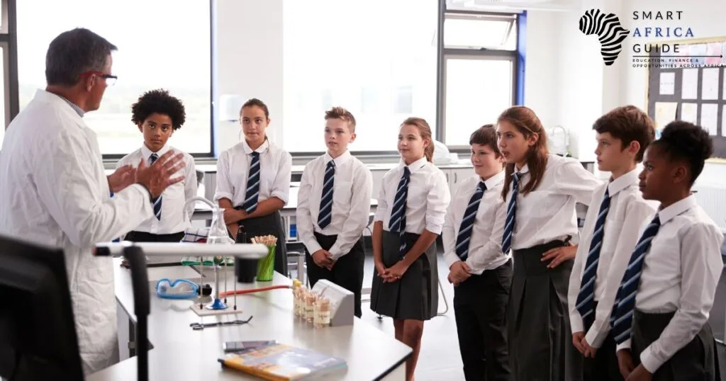 teacher talking to high school students of Mastercard Foundation Scholarship