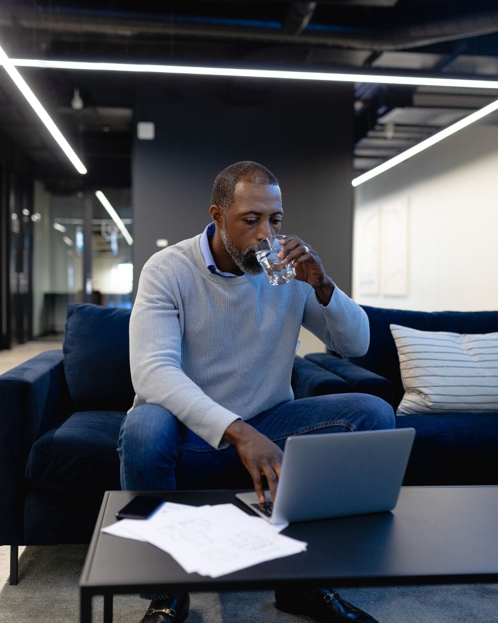 African man working on laptop in office