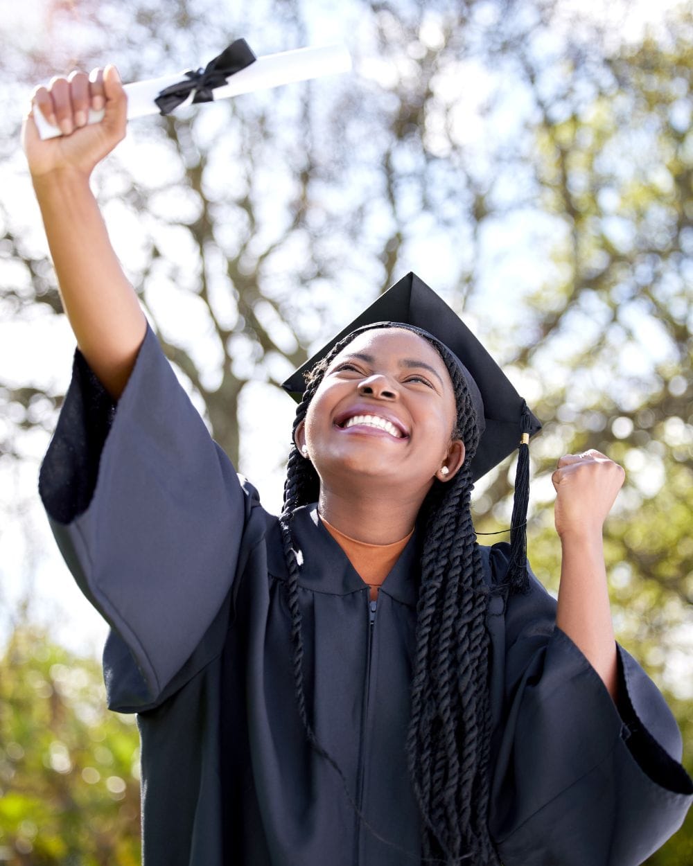 African student holding scholarship certificate