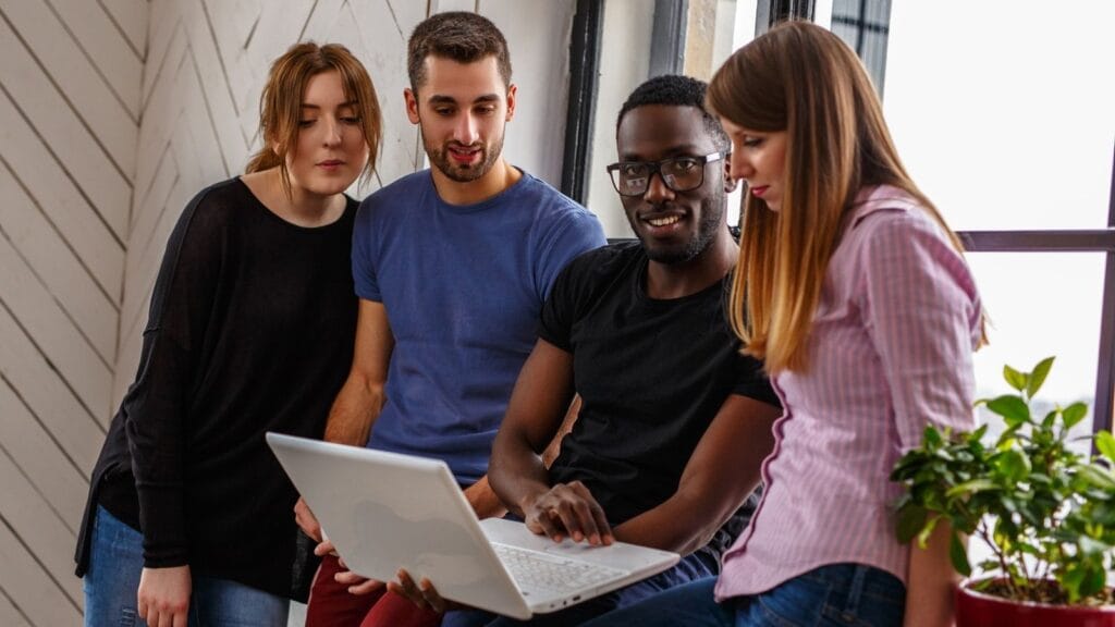 students learning using laptop in African University