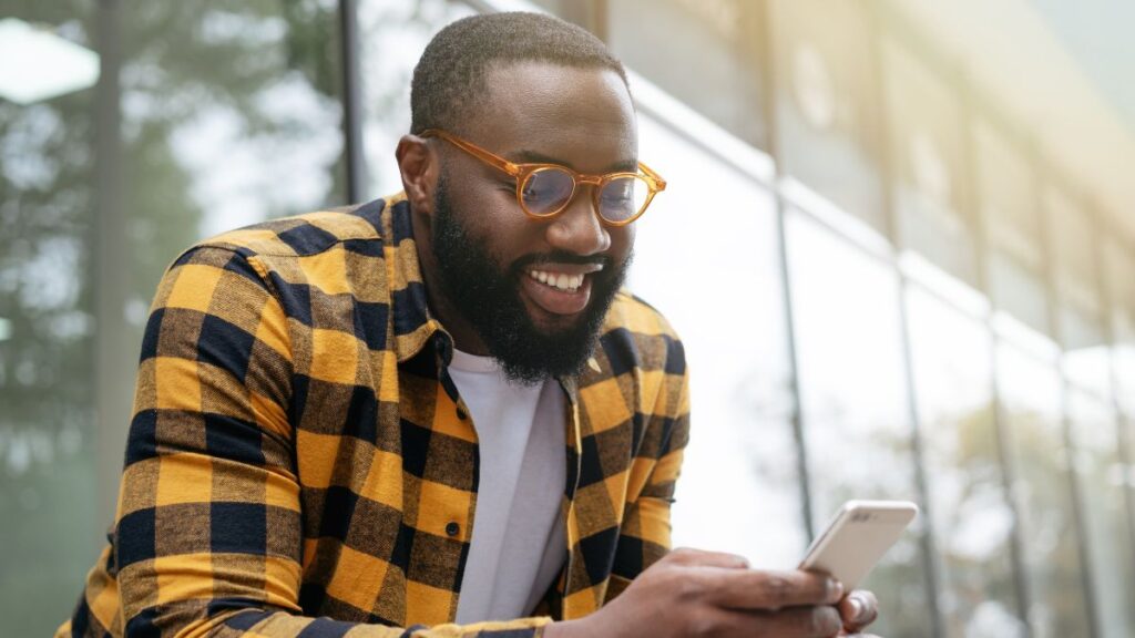 African man using phone