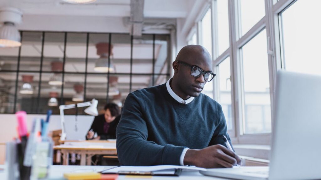 African student studying on laptop