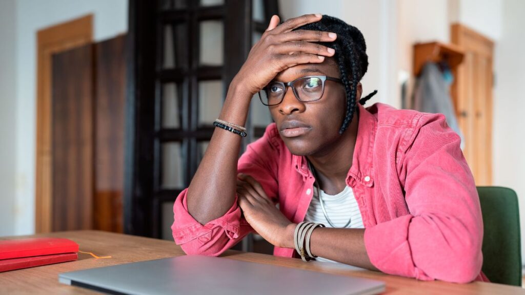 african student thinking as can't afford university fee