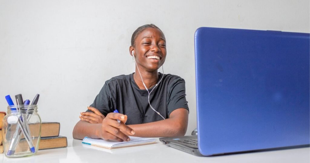 happy student studying on laptop